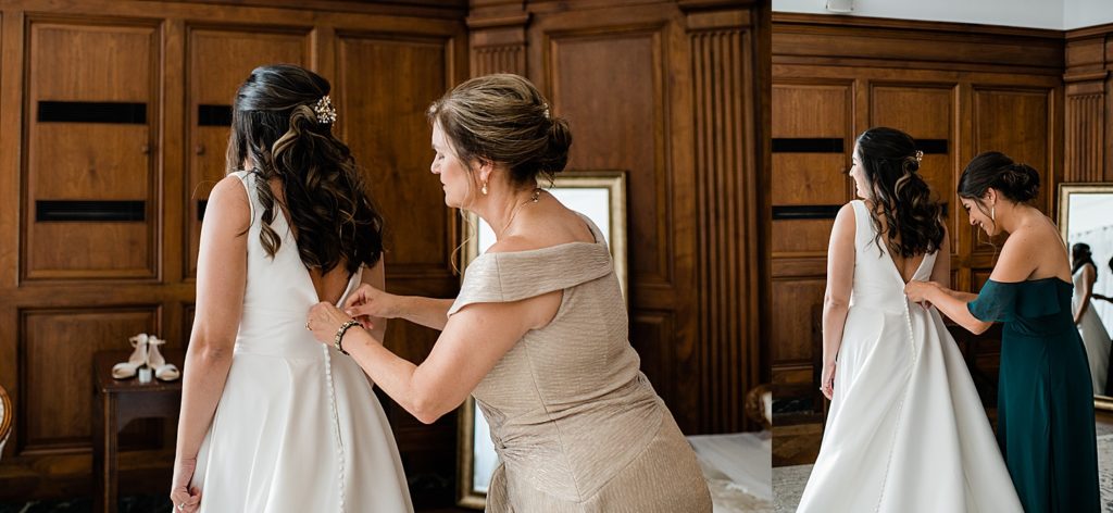 Bride getting her dress zipped up by her mom and maid of honor at her Michigan wedding in Pontiac.