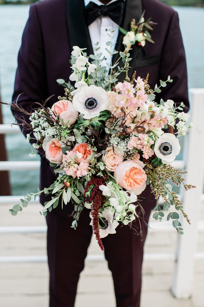 Pink and maroon floral bouquet for a wedding. 