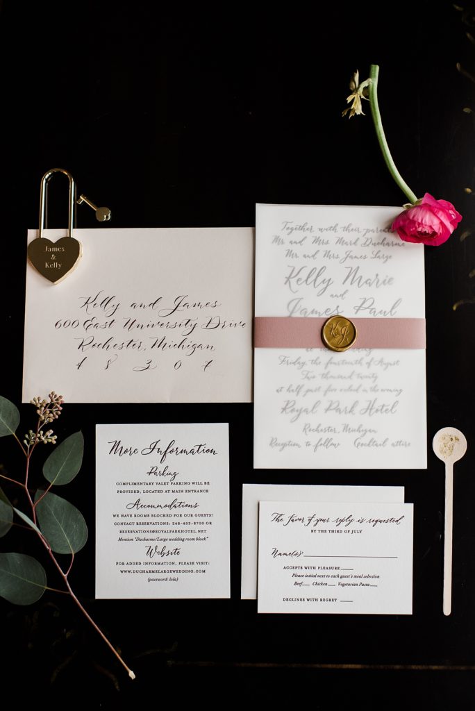 Flat lay of invitation set from a wedding at The Royal Park Hotel.