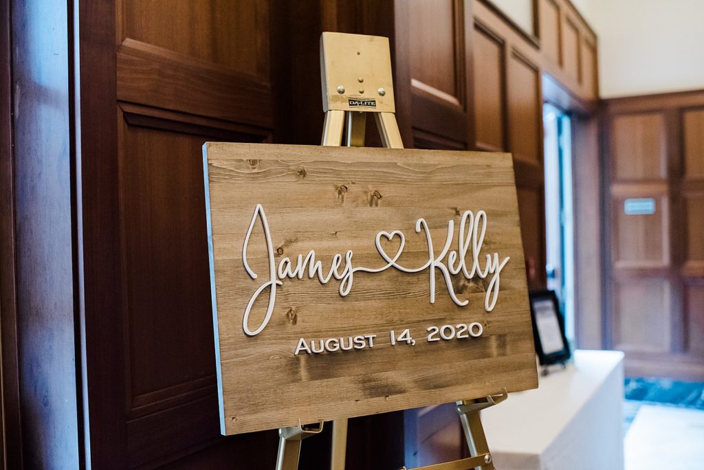 Wooden wedding sign saying "James Kelly, August 14th, 2020"