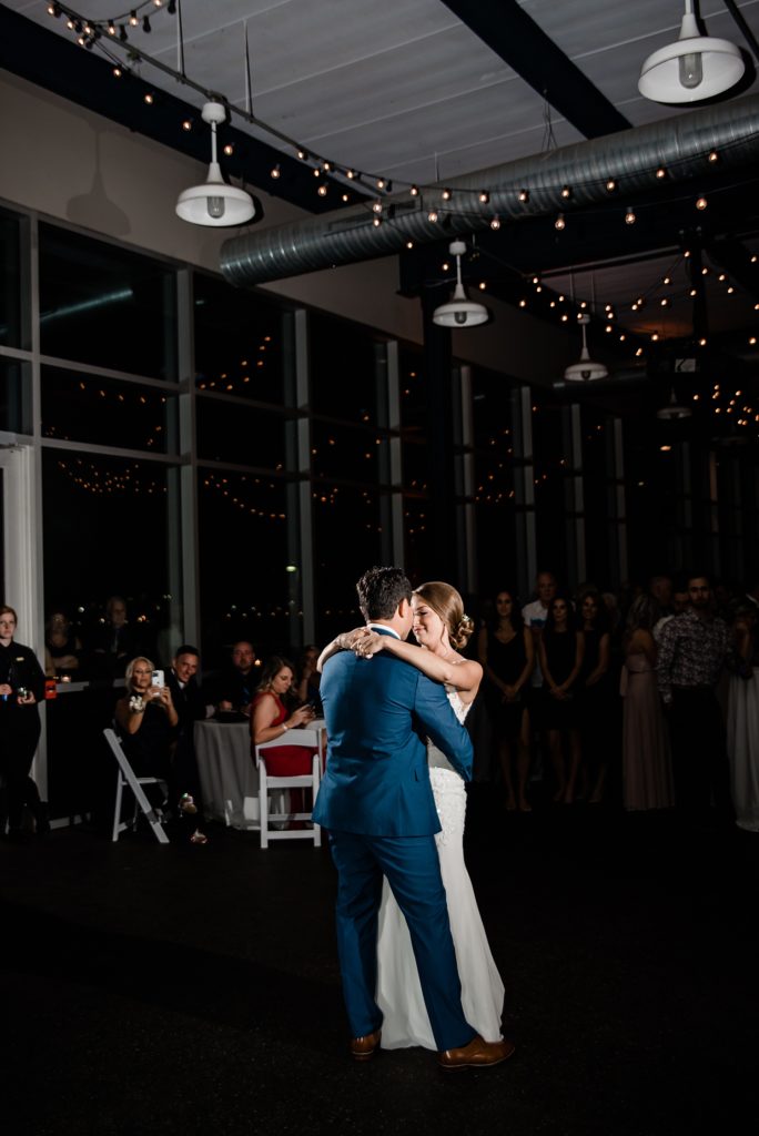 Bride and groom share a first dance at their Waterview Loft Wedding.