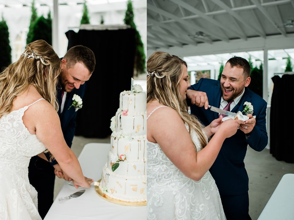 Bride and groom cutting the cake at their outdoor Michigan wedding reception.