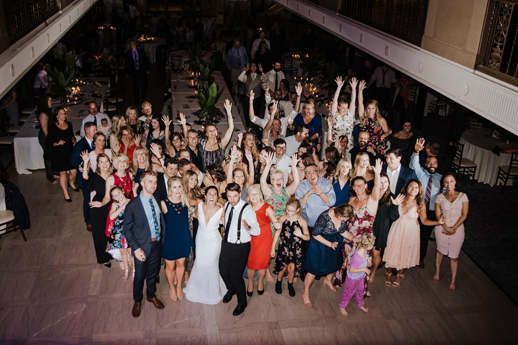 Large group photo from the balcony at The Treasury wedding venue. 