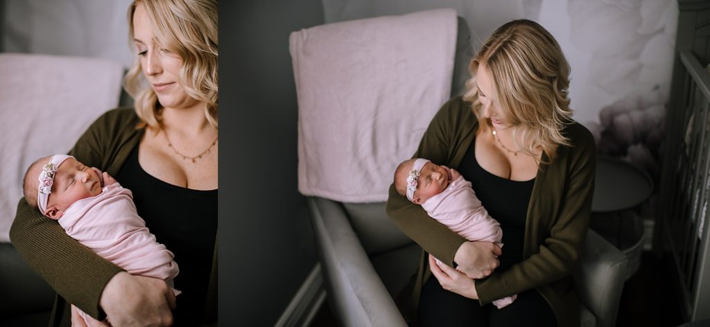 New mom with blonde hair holding her newborn baby in the nursery for their photo shoot. 