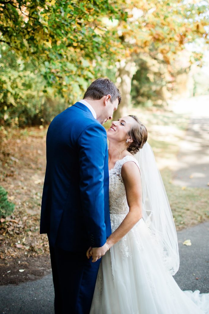 Bride and groom about to kiss at their first look before their Michigan wedding.