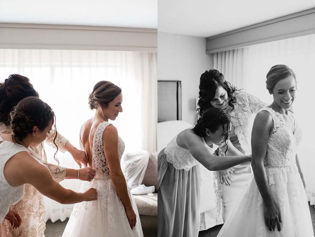 Bride getting her dressed zipped up by mother and bridesmaid before her Pine Trace Golf Course wedding.