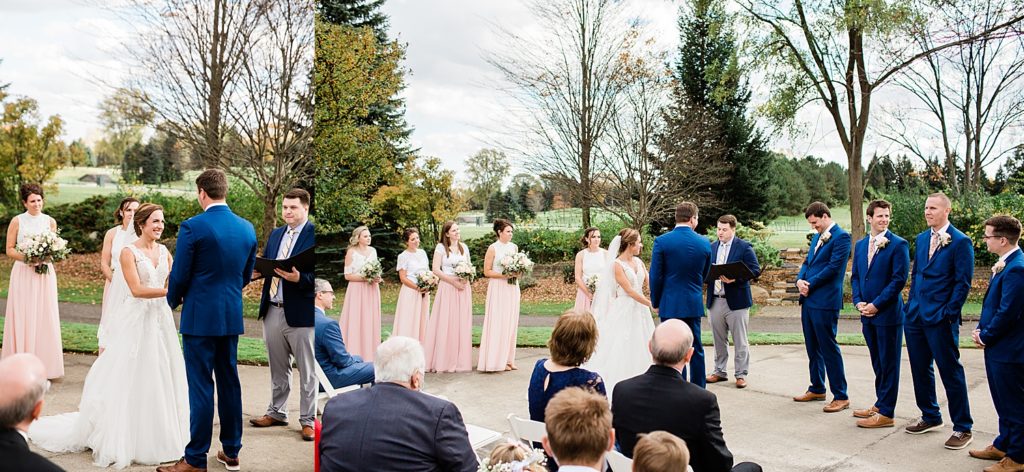Bride and groom at the alter with their wedding party in pink & navy around them.