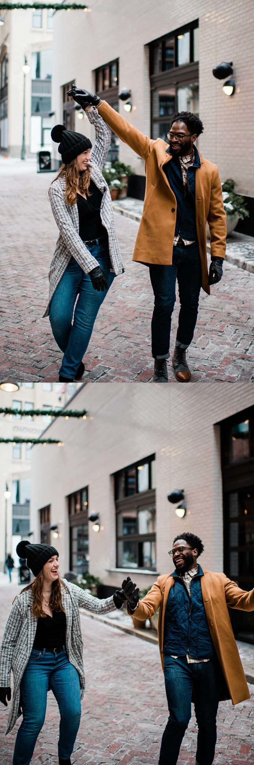 Engaged couple walking the streets of Detroit wearing blue jeans and beanies during winter session