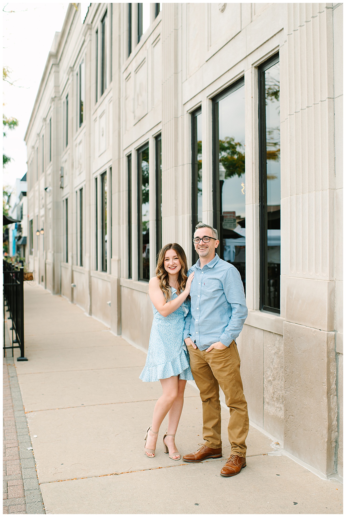 Woman holds hand on mans chest for Wyandotte engagement session