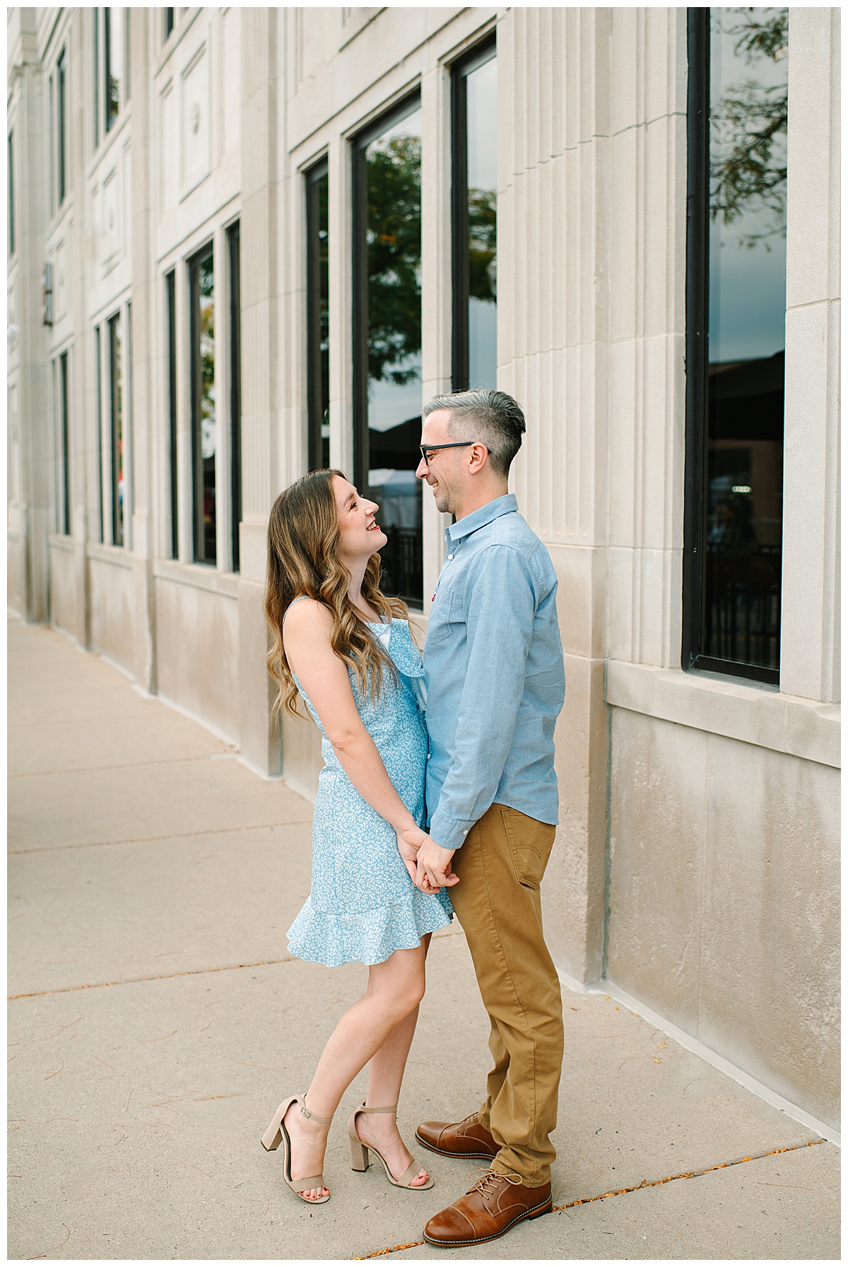 Couple look at each other with smiles for Wyandotte engagement session