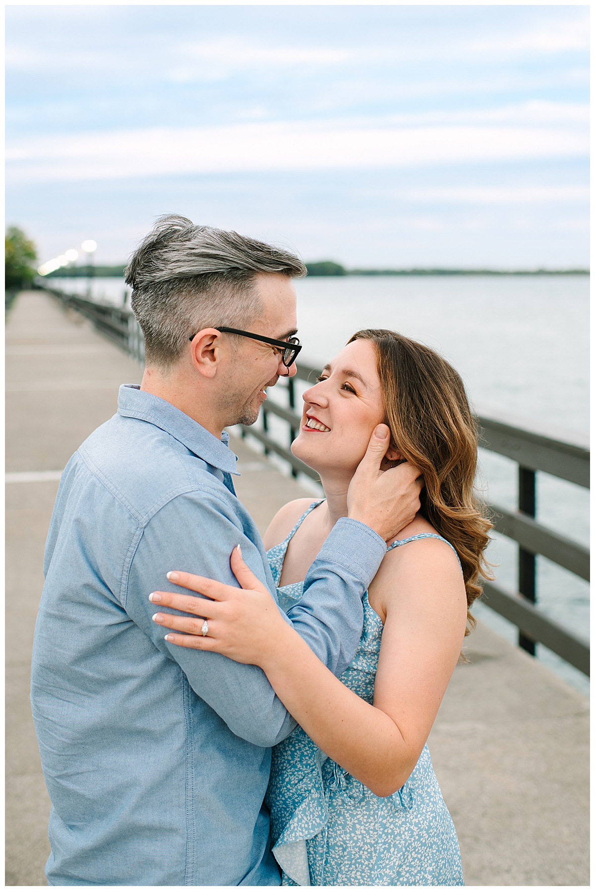 Man holds woman face for Wyandotte engagement session