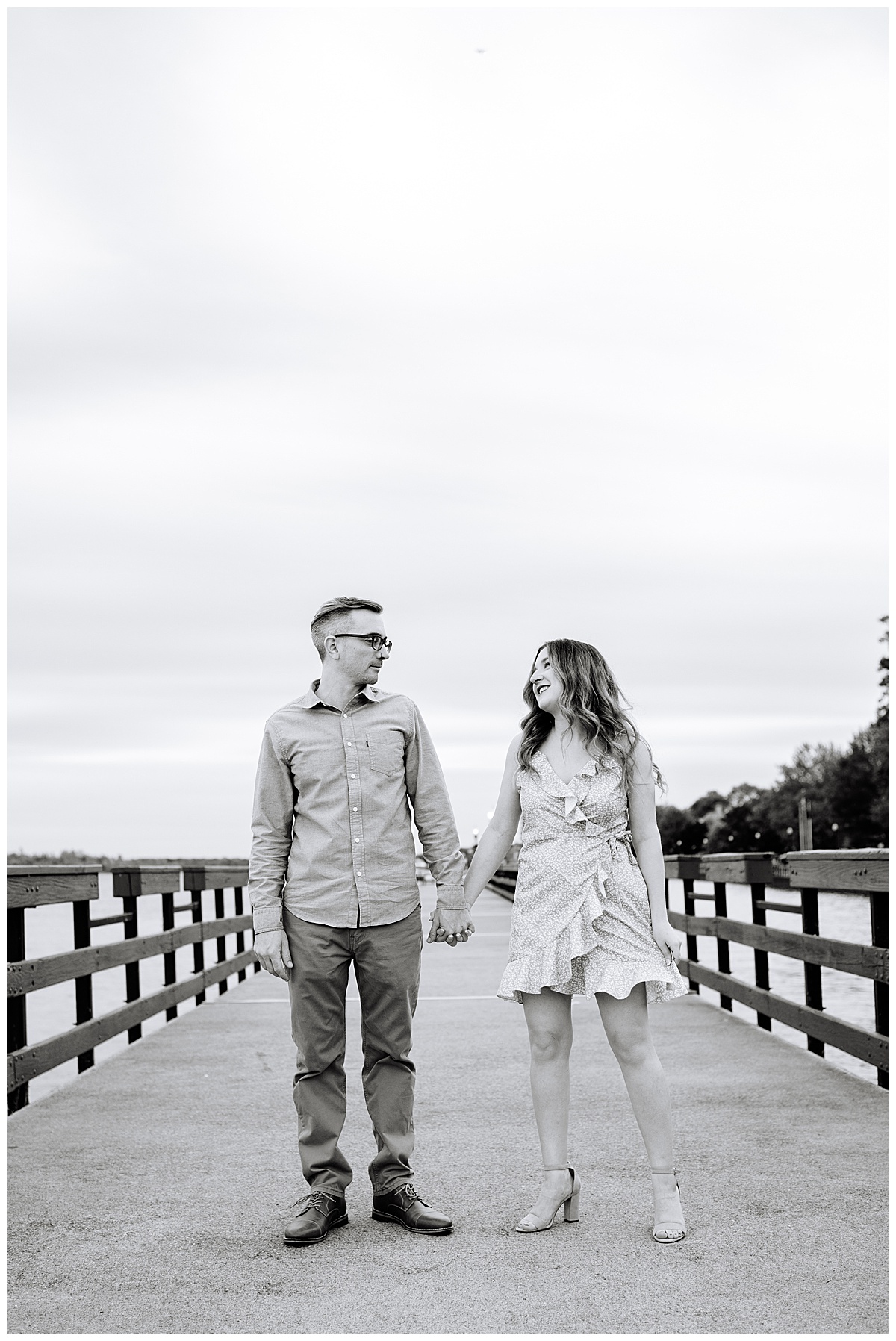 Man and woman hold hand and walk for Brittany Emerson Photography