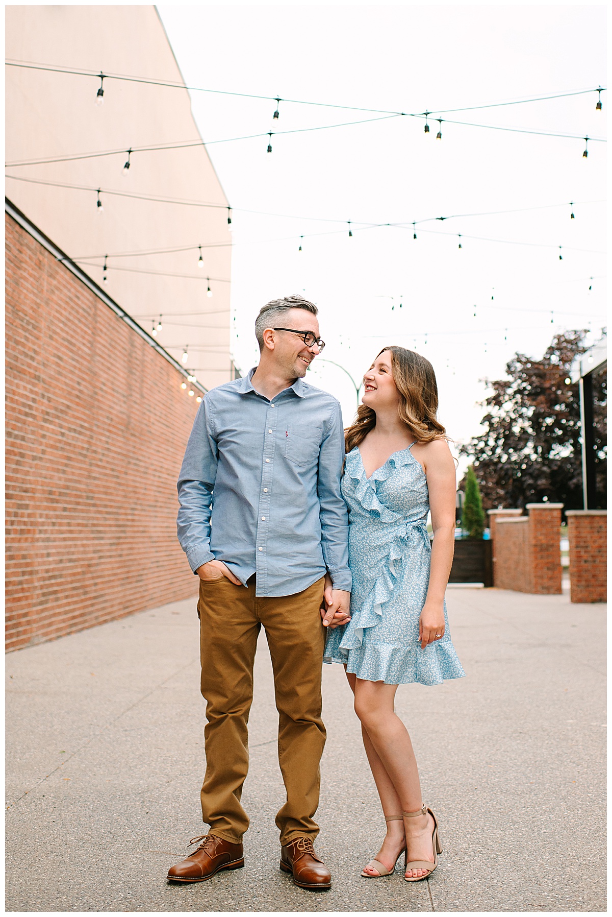 Fiancés walk down street together for Wyandotte engagement session