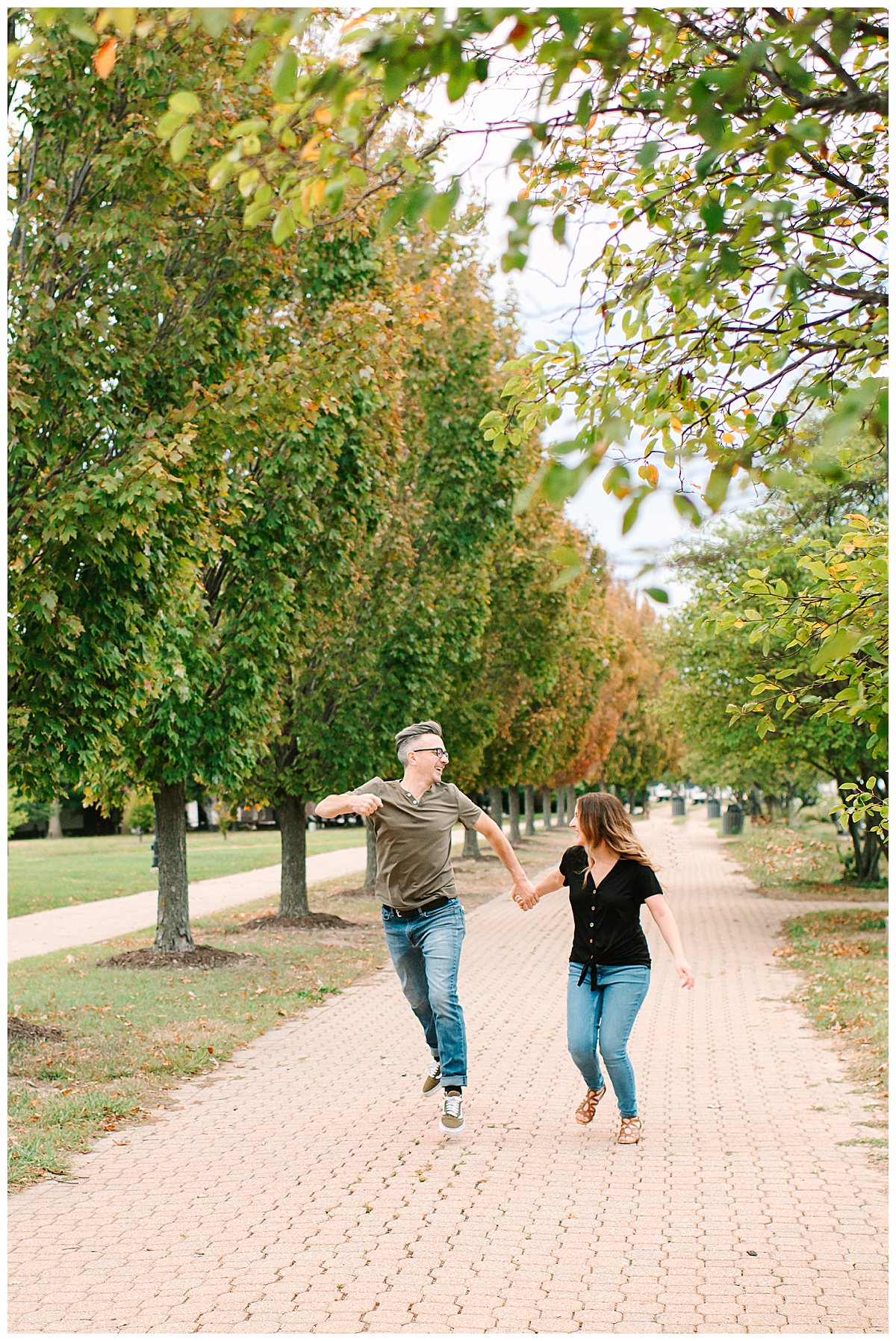 Couple runs and jumps for Brittany Emerson Photography