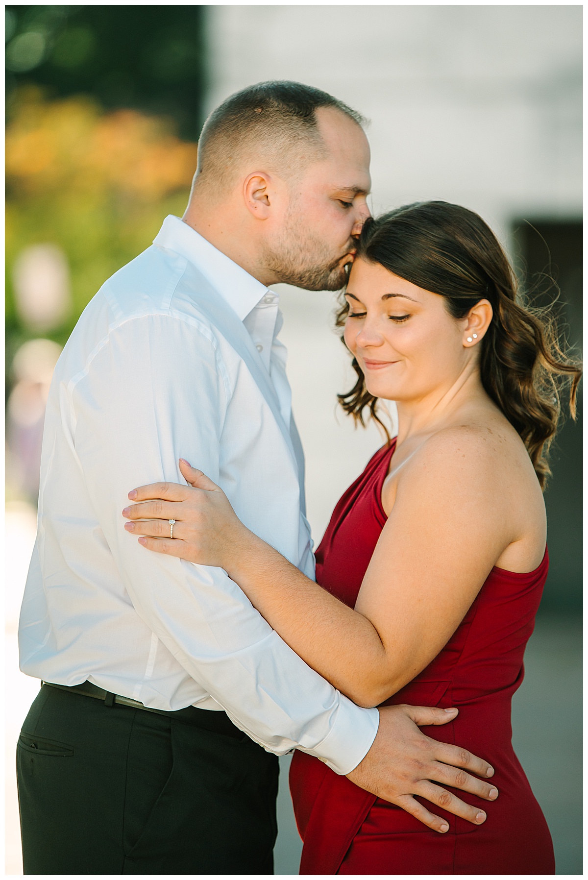 Man kisses woman on forehead for Michigan Wedding Photographer