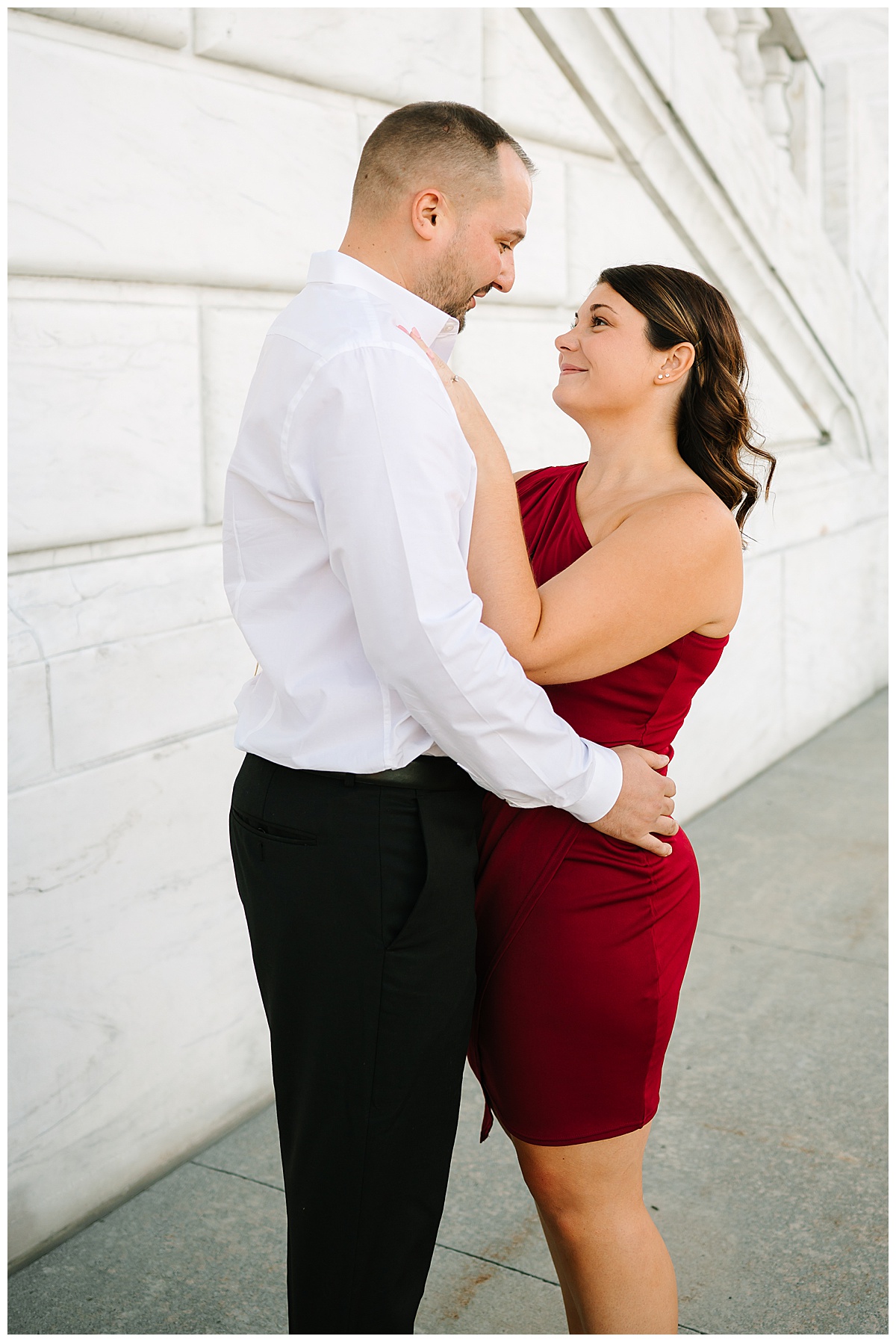 Woman smiles at man for Detroit Engagement Session