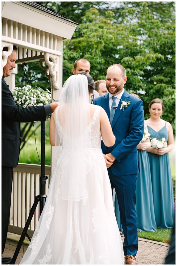 Groom smiling at bride for Michigan Wedding Photographer