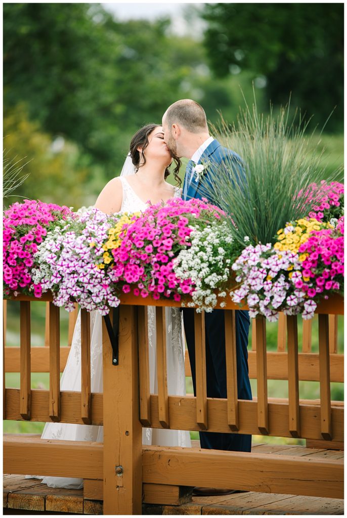 Husband and wife kissing for Michigan Wedding Photographer