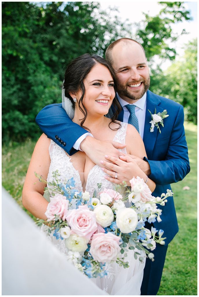 Newlyweds hug for Brittany Emerson Photography