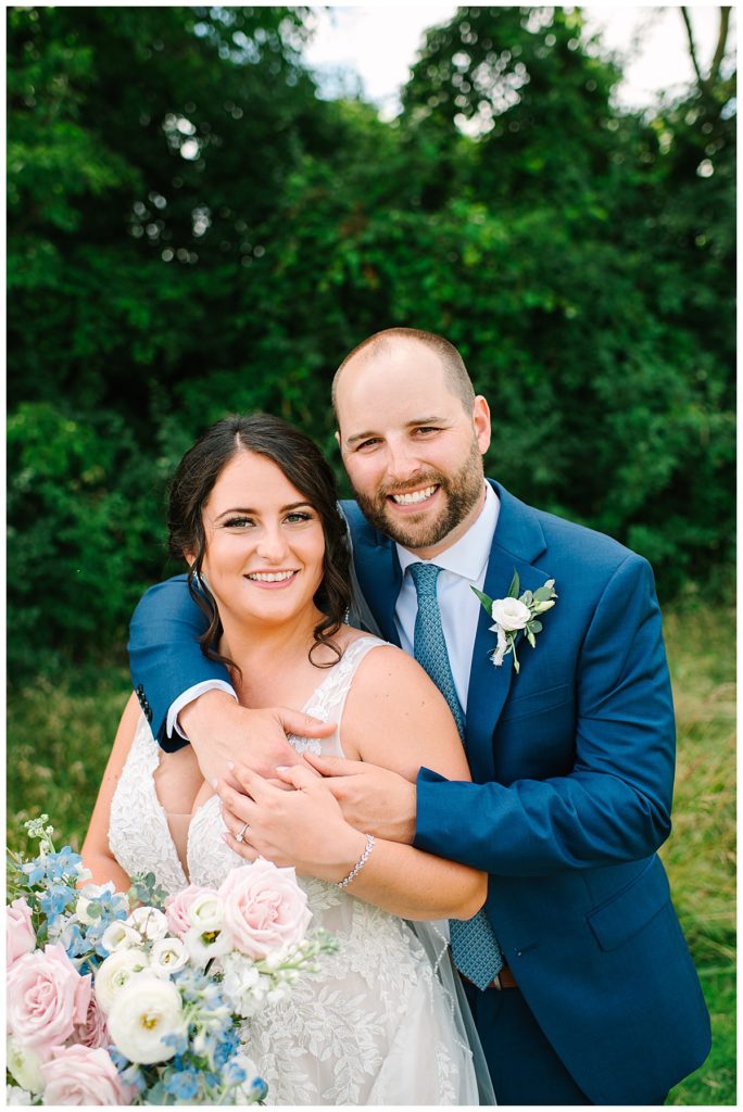Married couple smiling big for Michigan Wedding Photographer