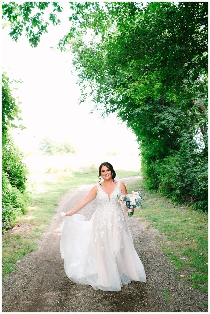 Bride twirling dress for Michigan Wedding Photographer