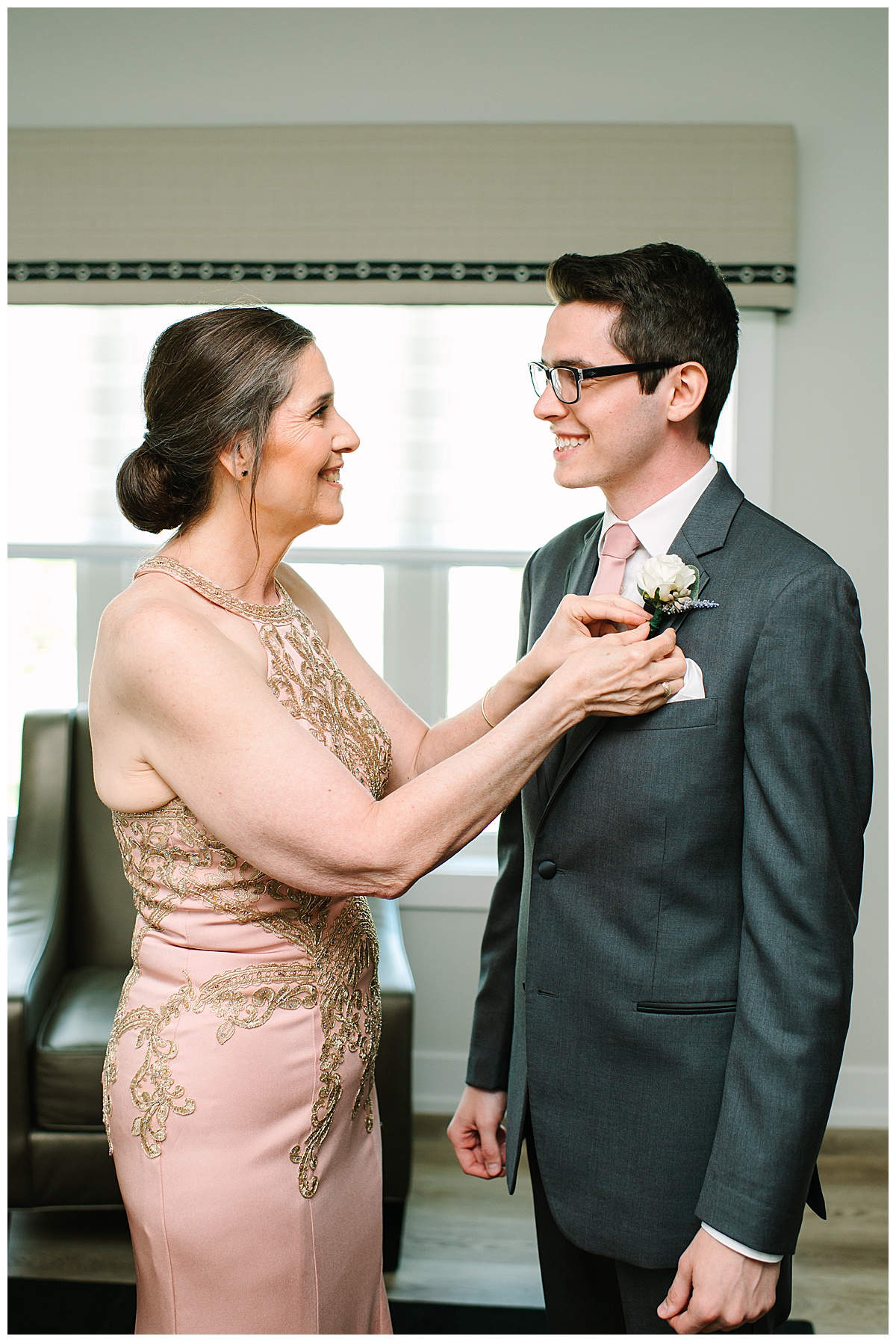 Mother adjust grooms boutonniere for  Michigan Wedding Photographer