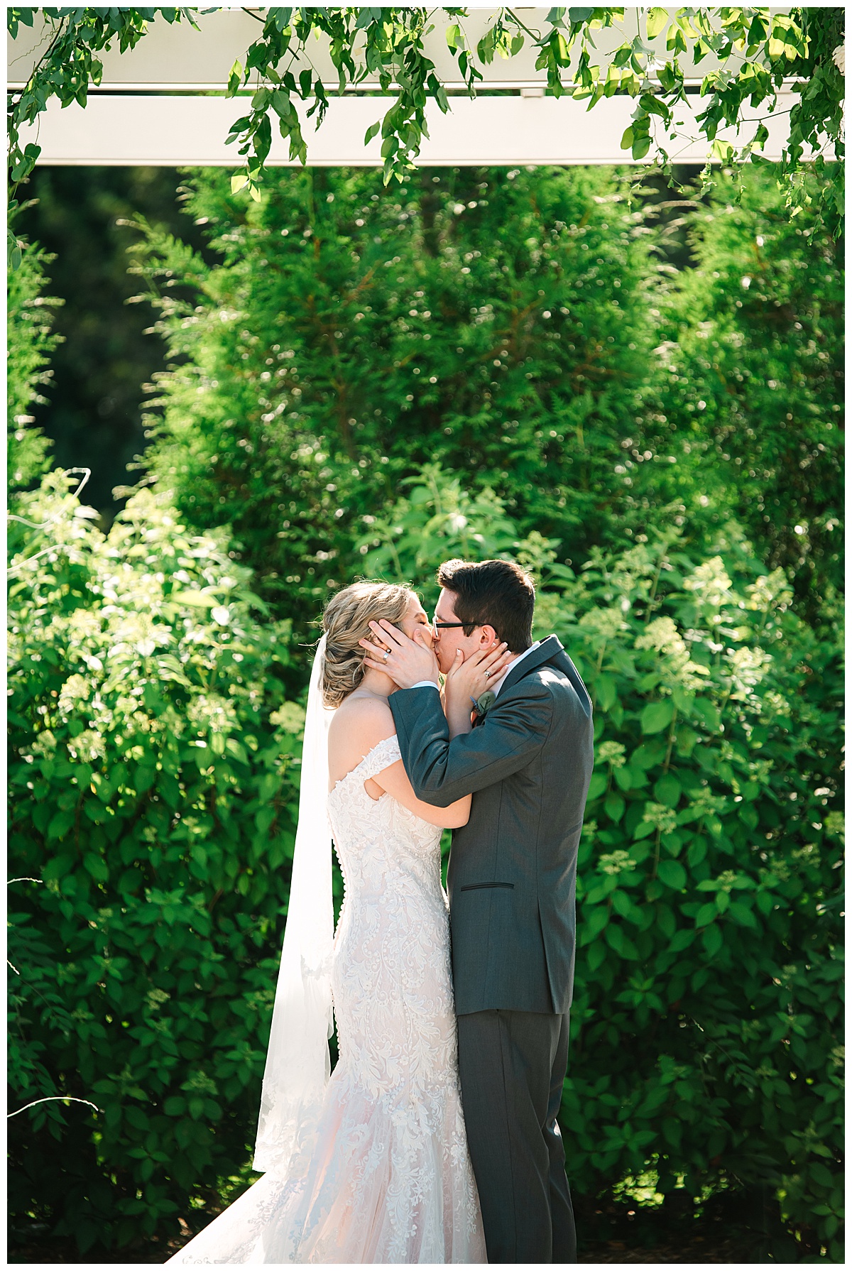First kiss for bride and groom by Brittany Emerson Photography