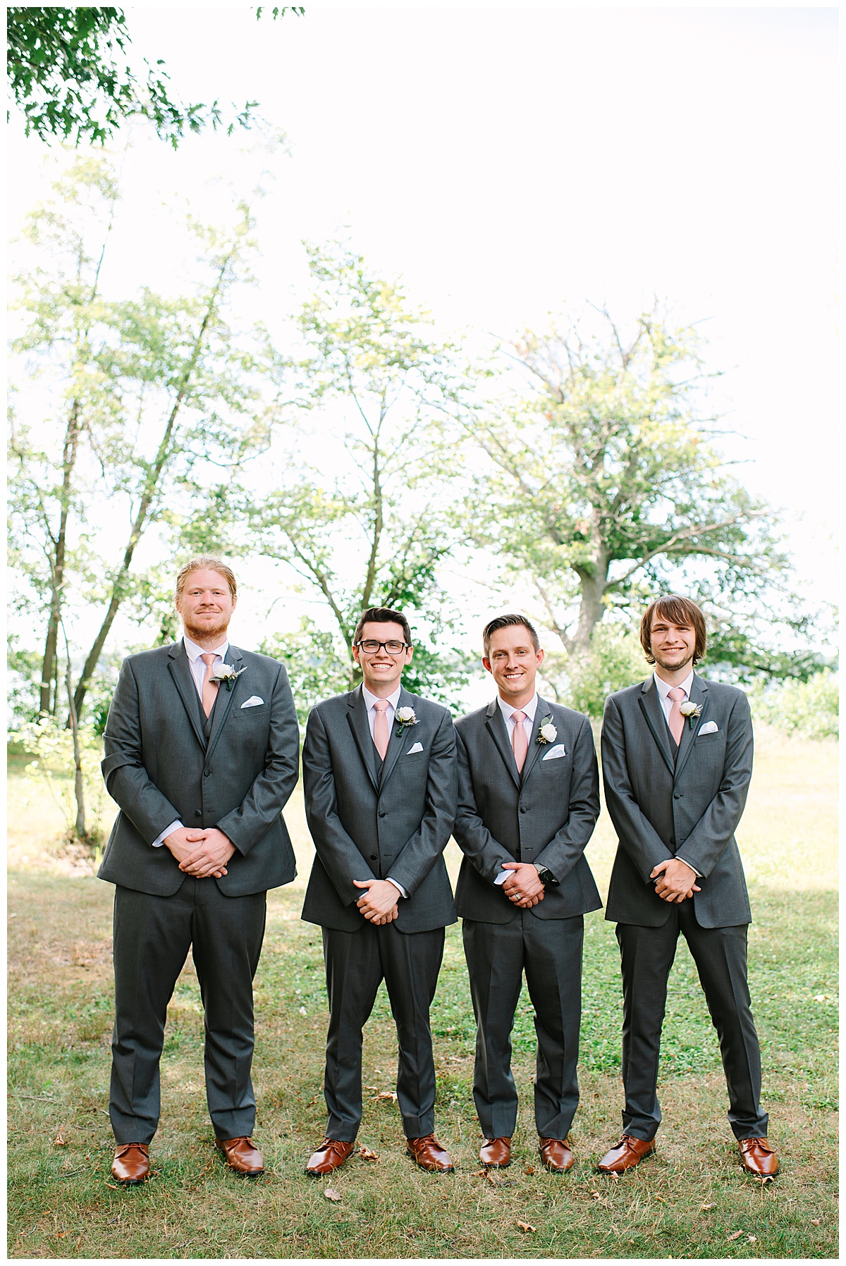 Groom in the middle of groomsmen for Michigan Wedding Photographer