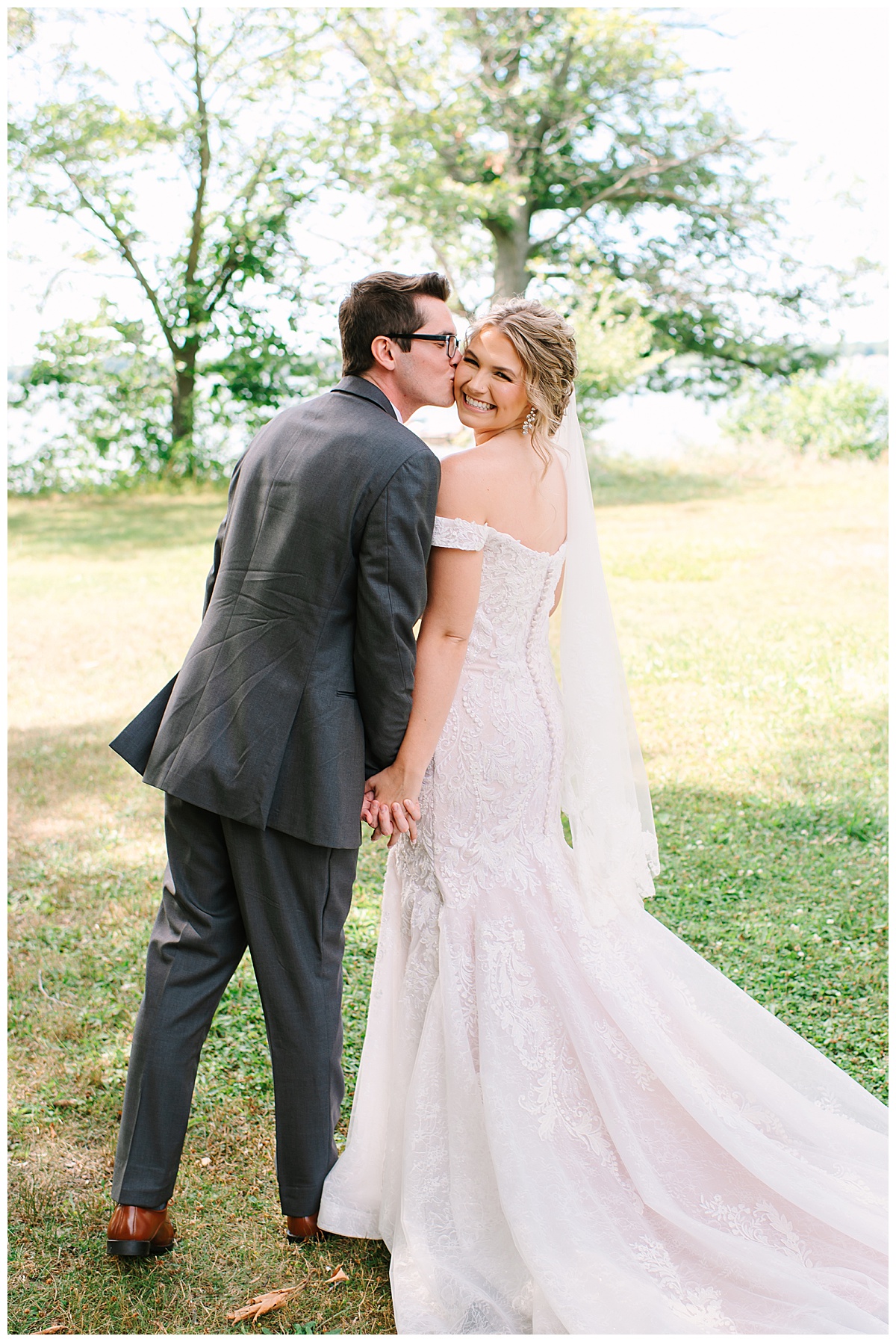 Cheek kiss by Brittany Emerson Photography