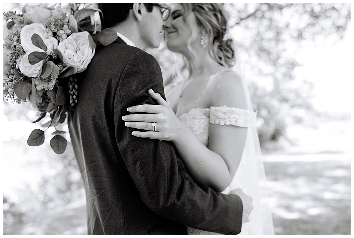 Newlyweds lean close by Michigan Wedding Photographer
