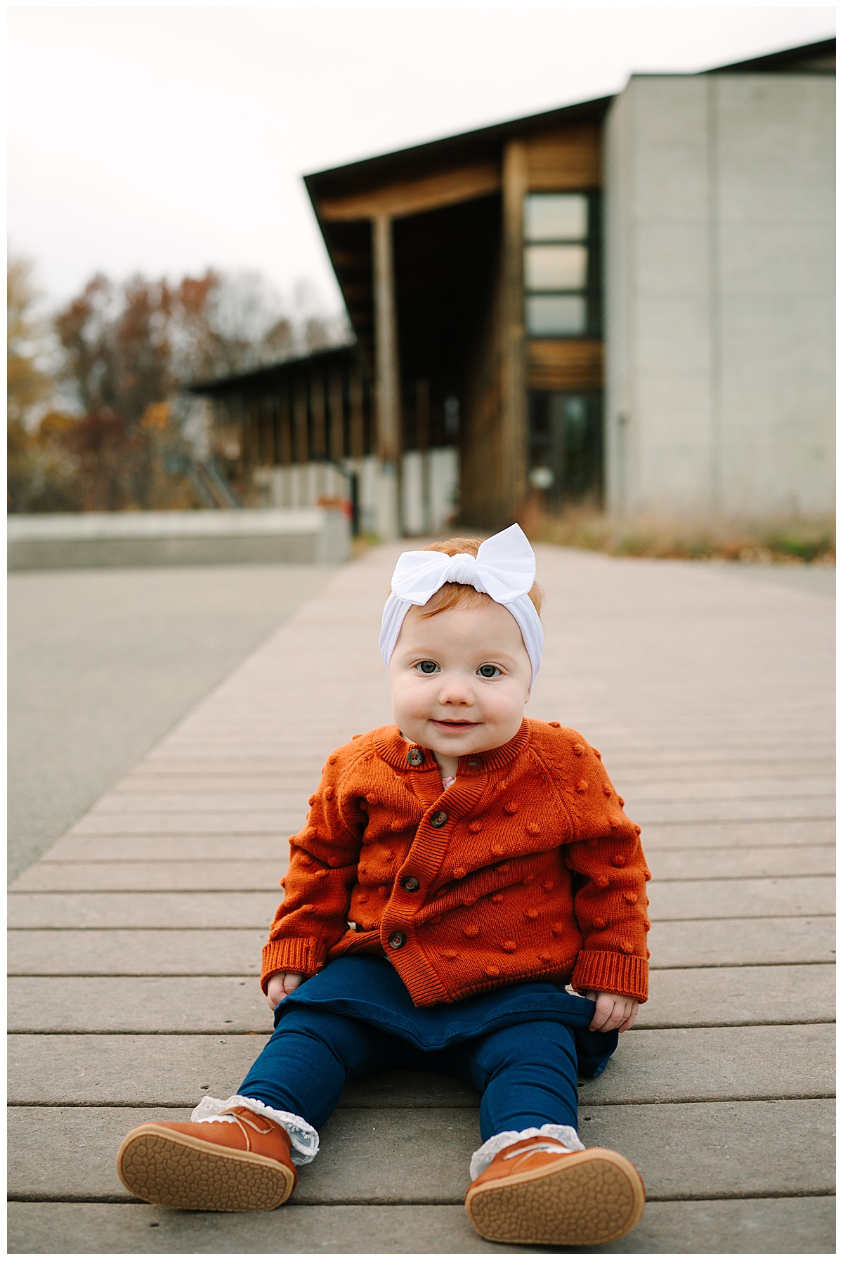 Baby girl sits on dock for Metro Detroit Session