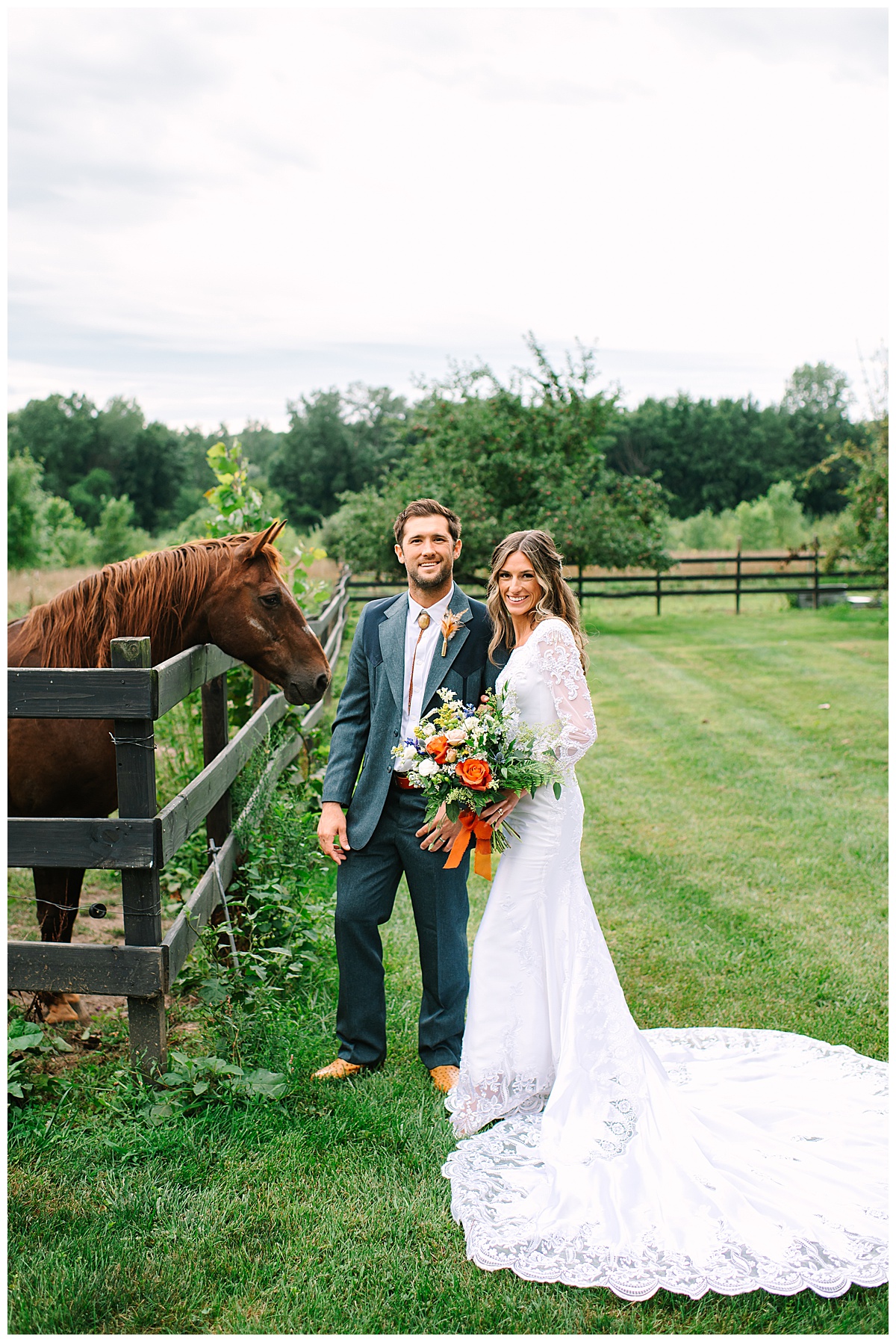 Couple stand near horse for Brittany Emerson Photography