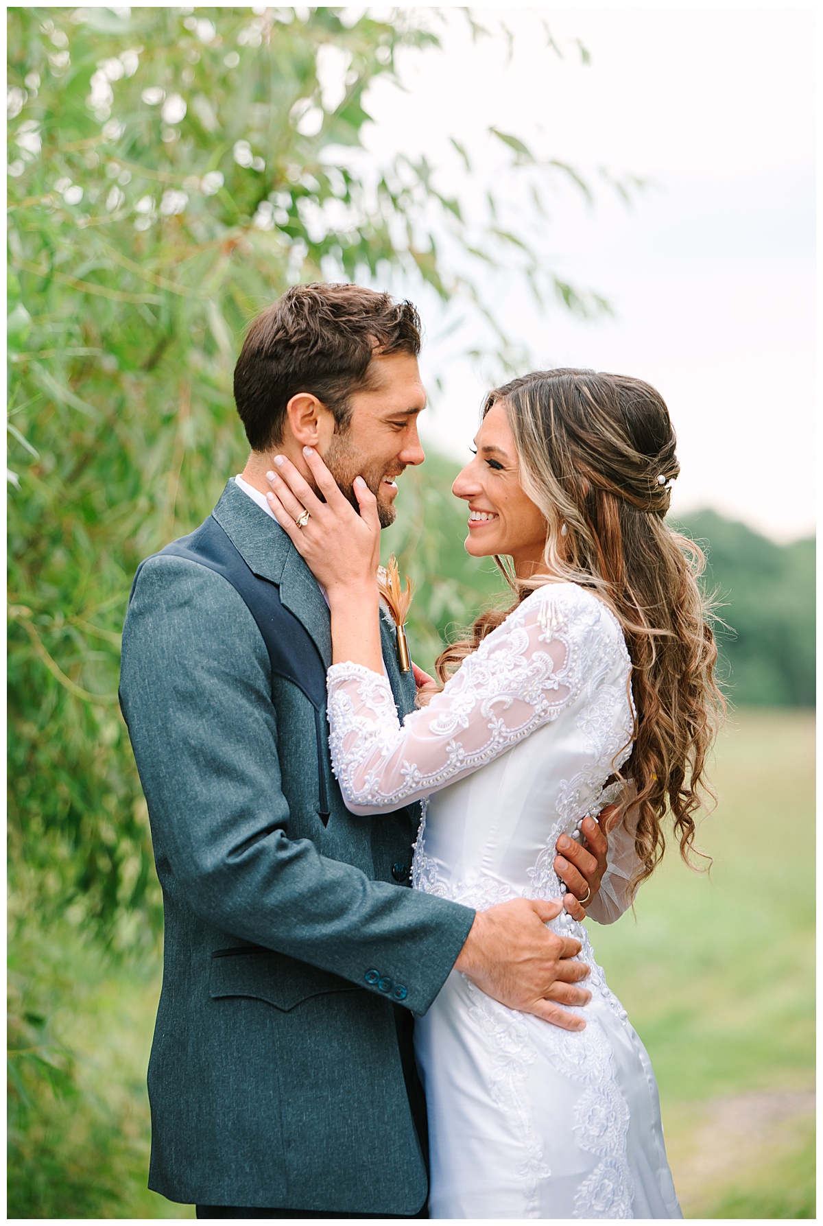 Bride holds groom in close for Michigan Wedding Photographer