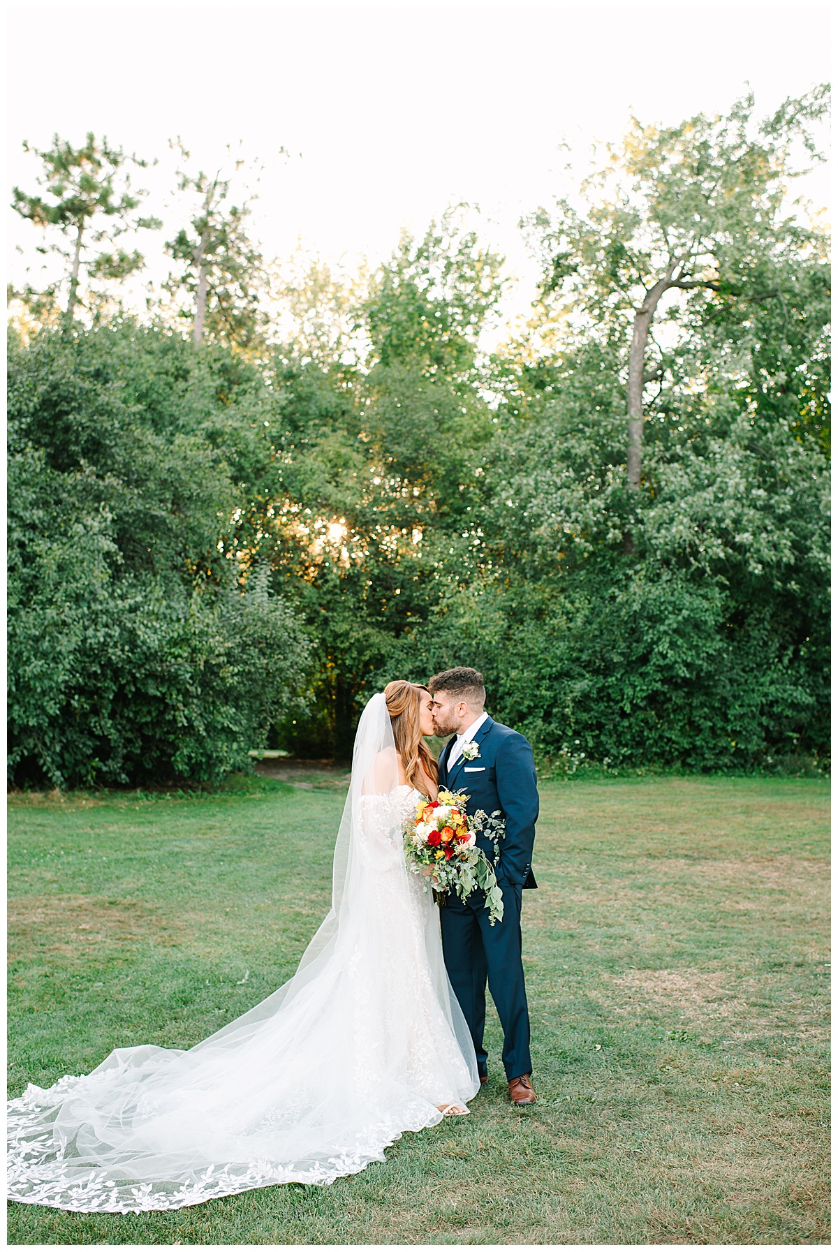 Couple share a kiss for Glen Oaks wedding