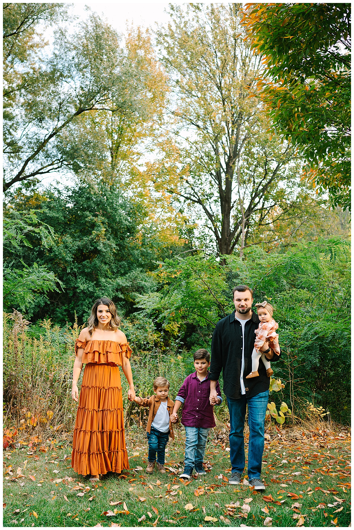 Parents and kids walking hand in hand for Brittany Emerson Photography