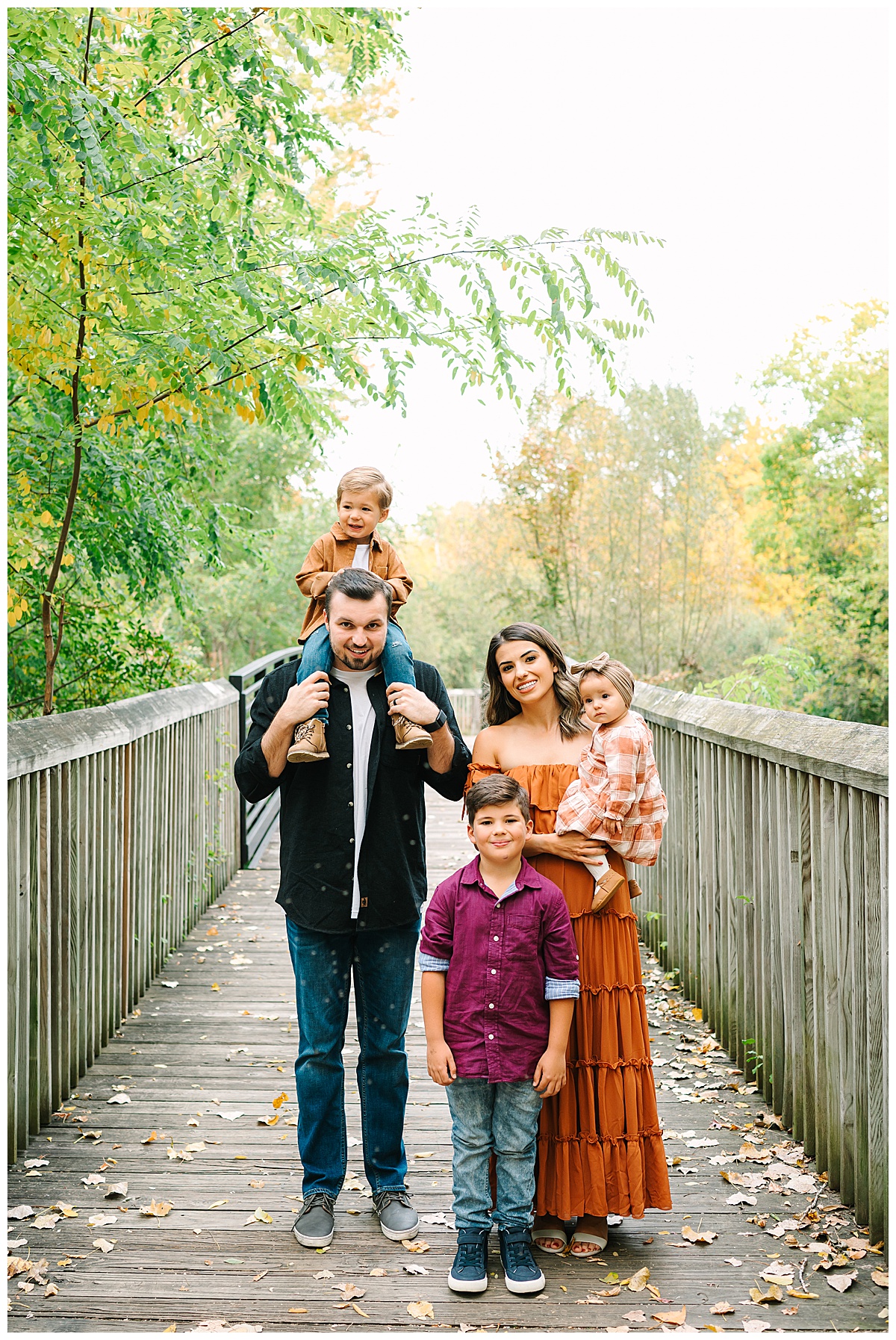 Group standing on bridge during Oakland County Family Session