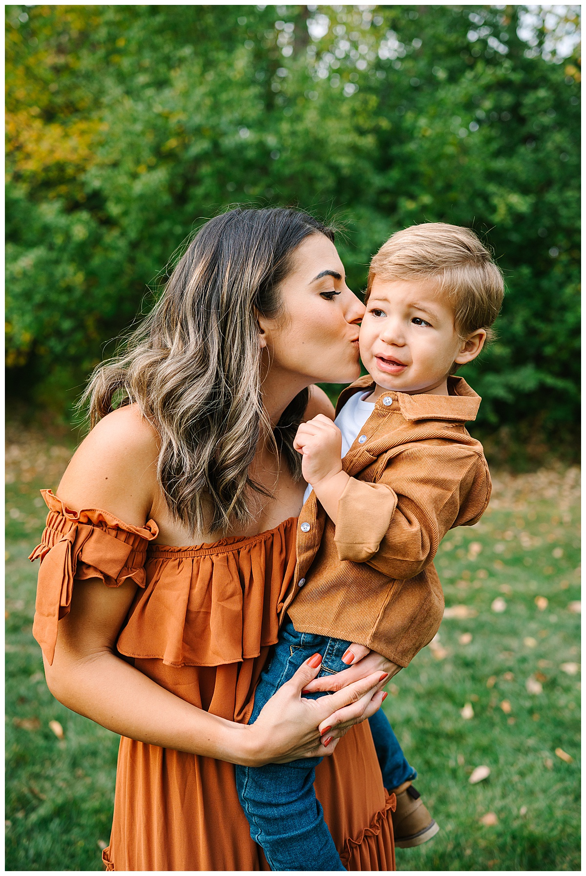 Mom holds young son for Brittany Emerson Photography